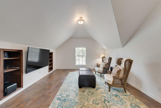 113 Bob White Ct, Rockwall, TX 75087 - sitting room with baseboards, hardwood / wood-style floors, lofted ceiling, and built in shelves