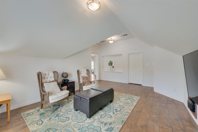 113 Bob White Ct, Rockwall, TX 75087 - living room featuring hardwood / wood-style floors, baseboards, vaulted ceiling, and visible vents