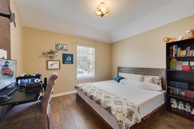113 Bob White Ct, Rockwall, TX 75087 - bedroom featuring dark wood-type flooring, lofted ceiling, and baseboards