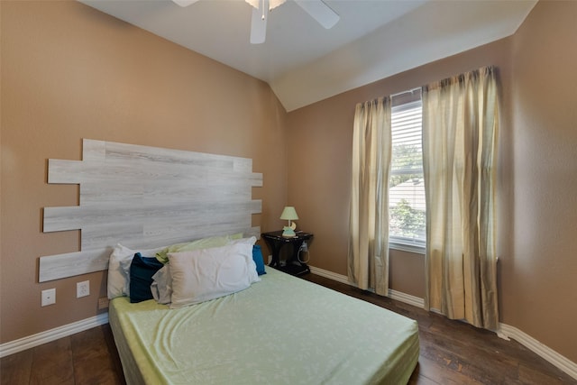 113 Bob White Ct, Rockwall, TX 75087 - bedroom with baseboards, a ceiling fan, vaulted ceiling, and dark wood-type flooring