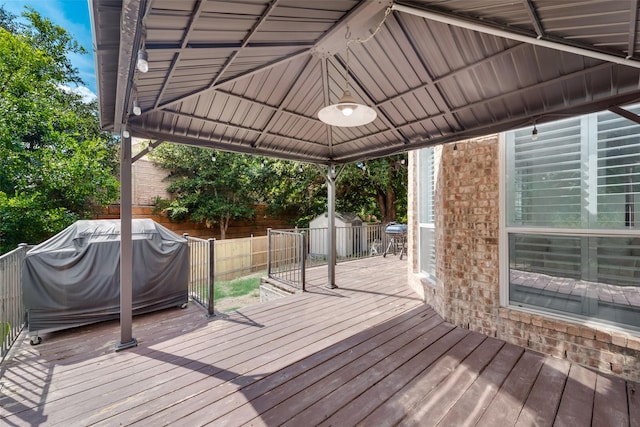 113 Bob White Ct, Rockwall, TX 75087 - wooden deck with an outbuilding, a fenced backyard, a grill, a gazebo, and a shed