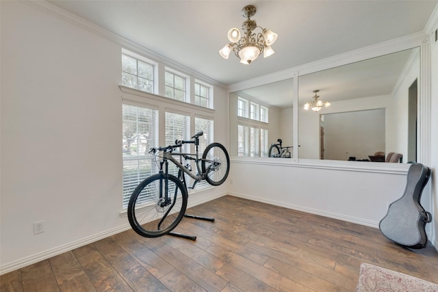113 Bob White Ct, Rockwall, TX 75087 - interior space with baseboards, dark wood-style floors, an inviting chandelier, and crown molding