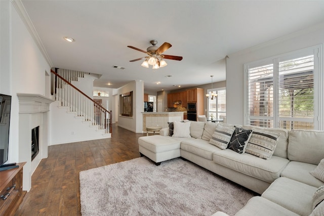 113 Bob White Ct, Rockwall, TX 75087 - living area featuring baseboards, stairway, ornamental molding, and dark wood finished floors
