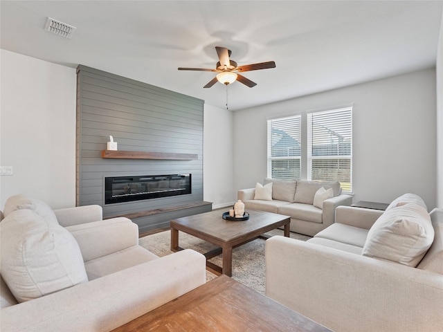 542 Freed Dr, Fate, TX 75087 - living room with a large fireplace and a ceiling fan