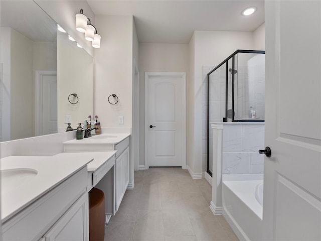 542 Freed Dr, Fate, TX 75087 - bathroom with vanity, a shower stall, a garden tub, tile patterned floors, and baseboards