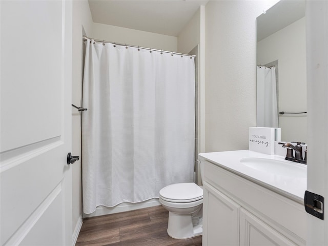 542 Freed Dr, Fate, TX 75087 - bathroom with vanity, toilet, wood finished floors, and shower / tub combo