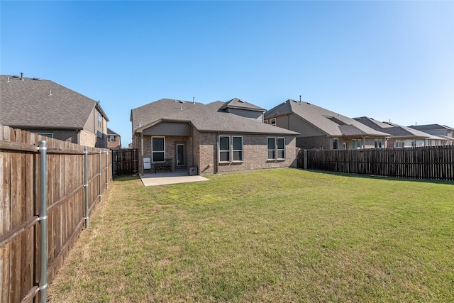 542 Freed Dr, Fate, TX 75087 - rear view of house featuring brick siding, a patio, and roof with shingles