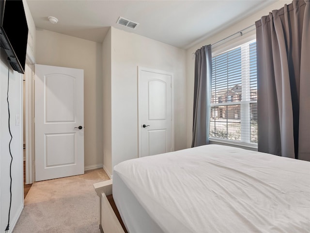 542 Freed Dr, Fate, TX 75087 - bedroom with multiple windows, light colored carpet, and baseboards