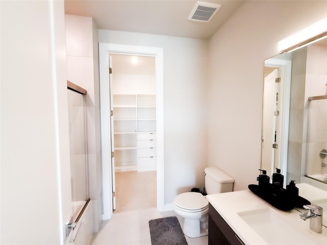 4011 Woodbine Ln, Prosper, TX 75078 - full bath with vanity, toilet, tile patterned floors, combined bath / shower with glass door, and visible vents
