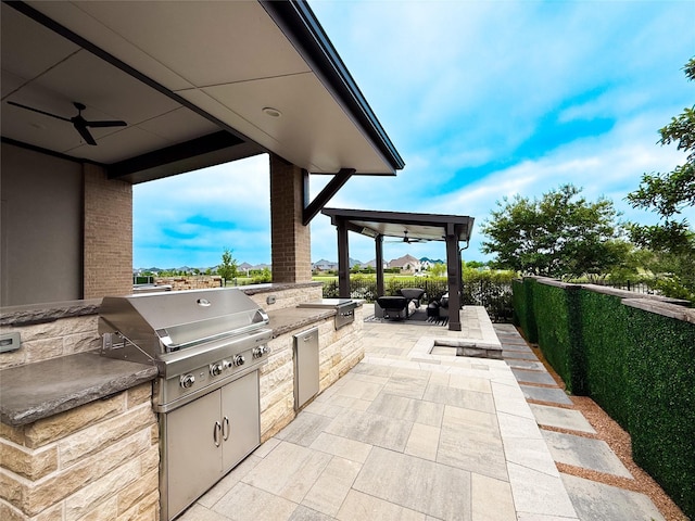 4011 Woodbine Ln, Prosper, TX 75078 - view of patio / terrace with grilling area, exterior kitchen, fence, and a ceiling fan