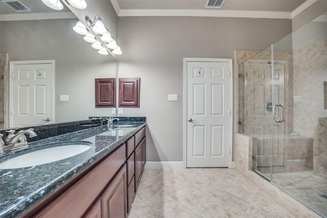 4523 W University Blvd, Dallas, TX 75209 - bathroom featuring double vanity, a stall shower, crown molding, baseboards, and tile patterned floors