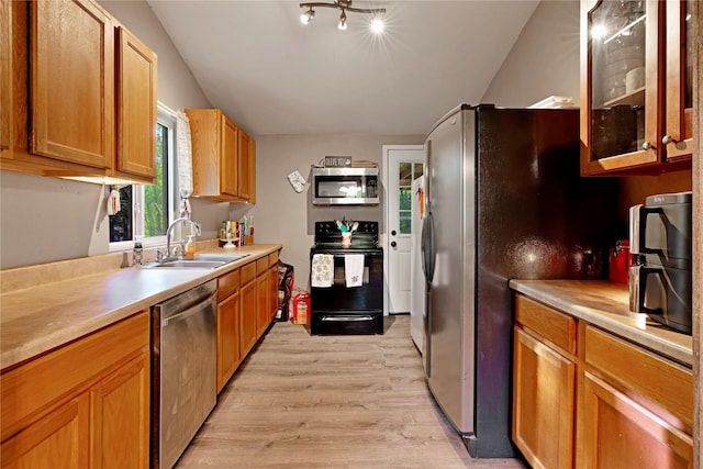 28 Private Road 45075, Powderly, TX 75473 - kitchen featuring a sink, light wood-type flooring, glass insert cabinets, light countertops, and appliances with stainless steel finishes