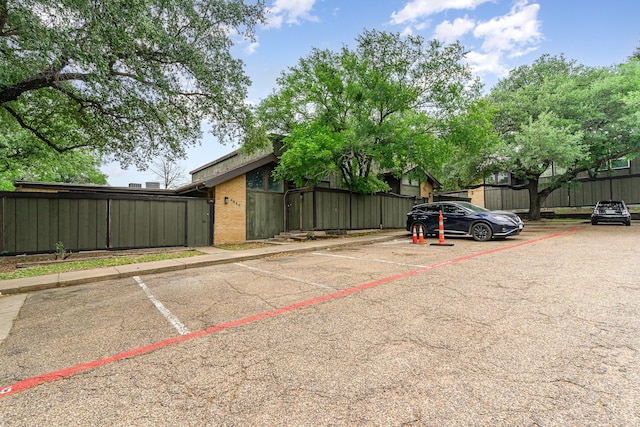 uncovered parking lot with fence