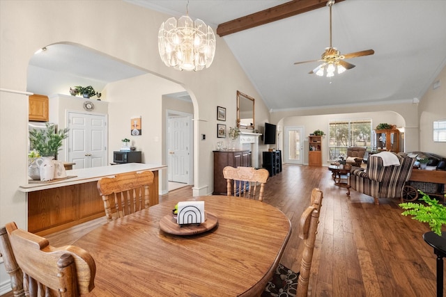 dining room with arched walkways, light wood-type flooring, beamed ceiling, ceiling fan, and high vaulted ceiling