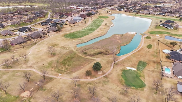 bird's eye view featuring a residential view, golf course view, and a water view