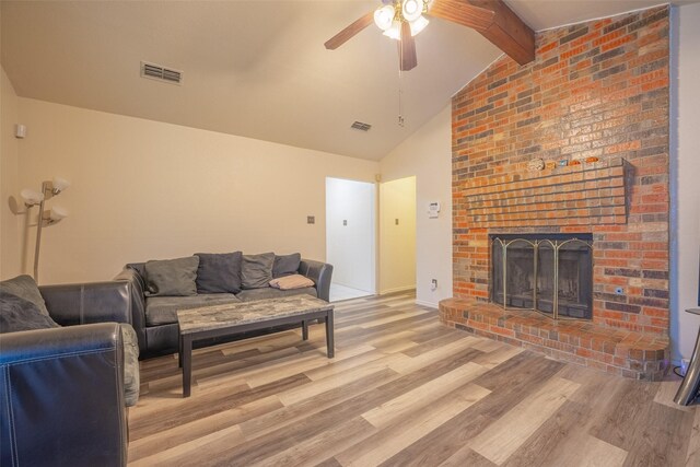 1234 Royal Oak Dr, Desoto, TX 75115 - living room with wood finished floors, vaulted ceiling with beams, a ceiling fan, and visible vents