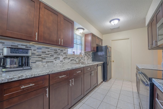 1234 Royal Oak Dr, Desoto, TX 75115 - kitchen with electric range, stainless steel dishwasher, a sink, decorative backsplash, and a textured ceiling