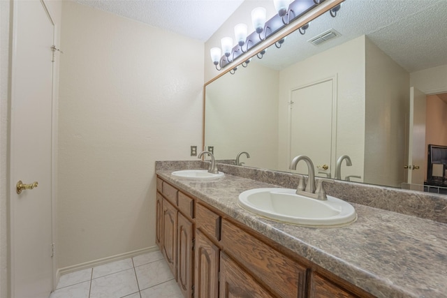 1234 Royal Oak Dr, Desoto, TX 75115 - bathroom featuring a sink, visible vents, and a textured ceiling