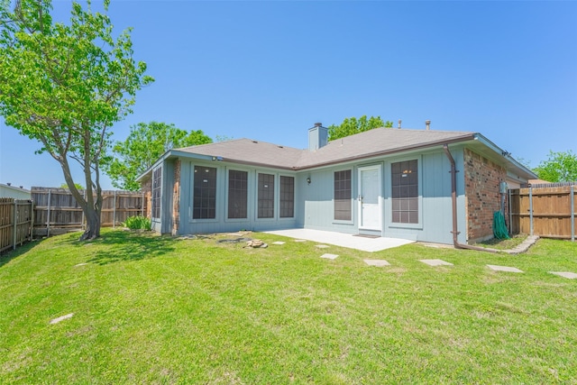 1234 Royal Oak Dr, Desoto, TX 75115 - back of house featuring a chimney, a fenced backyard, a yard, a patio area, and brick siding