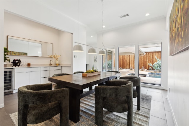 5724 Still Forest Dr, Dallas, TX 75252 - dining space featuring beverage cooler, light tile patterned flooring, ornamental molding, baseboards, and recessed lighting