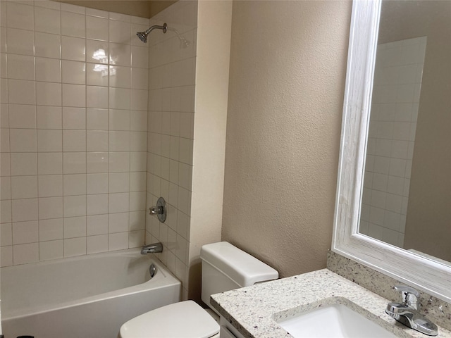 3833 Dana Ct, Abilene, TX 79606 - bathroom featuring vanity, a textured wall, bathing tub / shower combination, and toilet