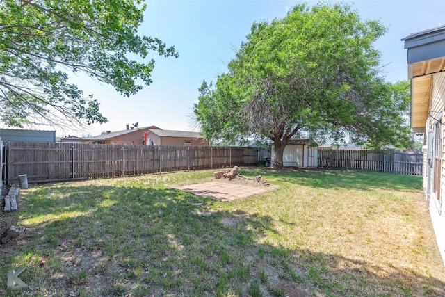 3833 Dana Ct, Abilene, TX 79606 - view of yard featuring an outdoor structure, a fenced backyard, and a storage shed