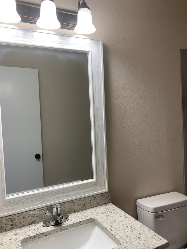 3833 Dana Ct, Abilene, TX 79606 - full bath featuring visible vents, wood finished floors, shower / washtub combination, vanity, and toilet