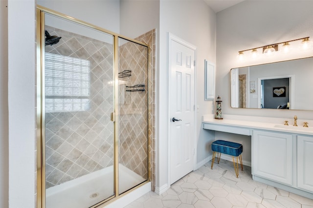 full bath featuring baseboards, vanity, tile patterned flooring, and a shower stall