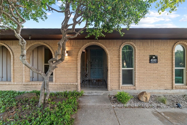 property entrance with brick siding