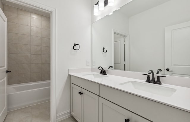 1624 Cottonwood Valley Dr, Celina, TX 75009 - bathroom with double vanity, tile patterned flooring, bathing tub / shower combination, and baseboards