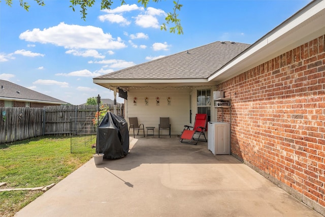 view of patio / terrace featuring a fenced backyard and a grill