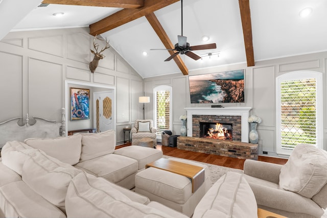 1500 Harrington Dr, Plano, TX 75075 - living area featuring a decorative wall, wood finished floors, a brick fireplace, and a ceiling fan