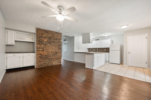 6606 Greenfield Dr, Arlington, TX 76016 - kitchen featuring ceiling fan, white cabinets, light wood finished floors, and freestanding refrigerator
