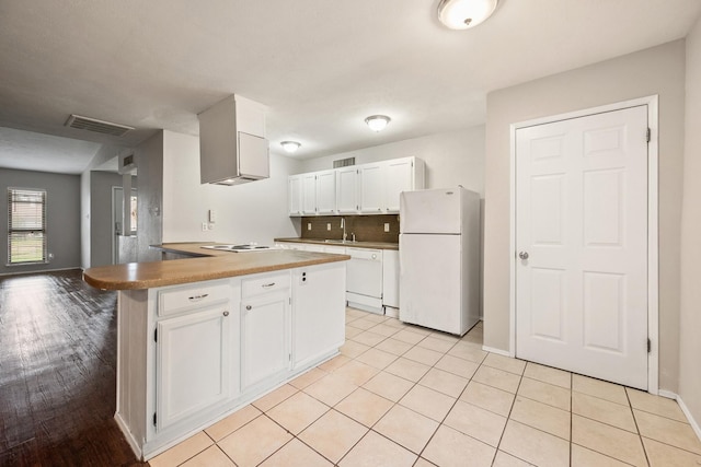 6606 Greenfield Dr, Arlington, TX 76016 - kitchen with a sink, white appliances, white cabinets, baseboards, and visible vents