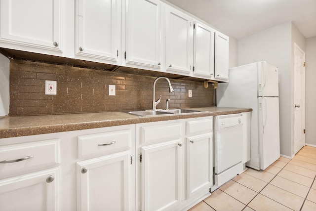 6606 Greenfield Dr, Arlington, TX 76016 - kitchen featuring white cabinets, dishwasher, light tile patterned floors, a sink, and decorative backsplash