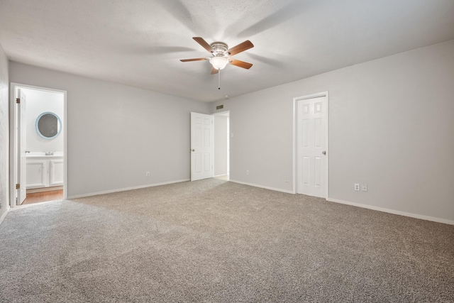 6606 Greenfield Dr, Arlington, TX 76016 - unfurnished bedroom with ensuite bath, baseboards, visible vents, and carpet