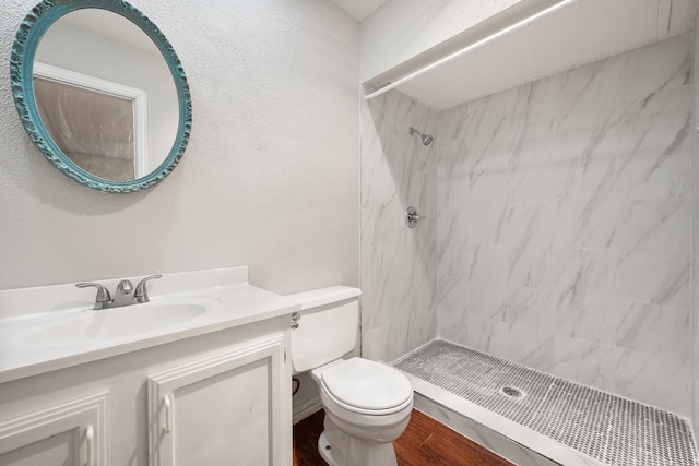 6606 Greenfield Dr, Arlington, TX 76016 - full bath with a stall shower, wood finished floors, vanity, and toilet