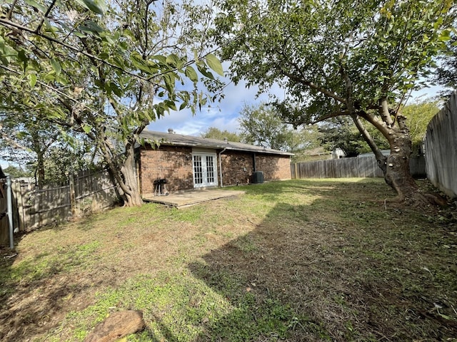 6606 Greenfield Dr, Arlington, TX 76016 - view of yard with a fenced backyard, french doors, and a patio
