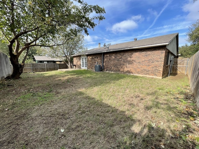 6606 Greenfield Dr, Arlington, TX 76016 - view of yard featuring a fenced backyard, central air condition unit, and french doors