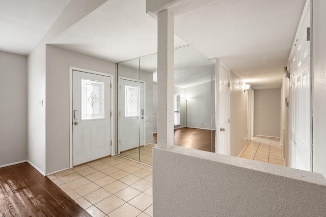 6606 Greenfield Dr, Arlington, TX 76016 - entryway with baseboards and light tile patterned floors