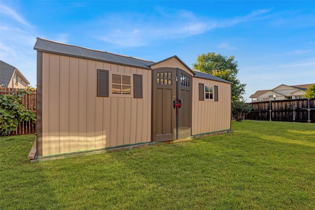 view of shed with a fenced backyard