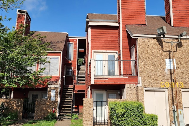 9805 Walnut St Unit 308, Dallas, TX 75243 - view of property with stairs and fence private yard