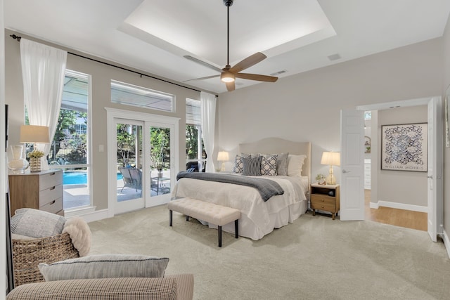 bedroom with light carpet, french doors, baseboards, access to outside, and visible vents