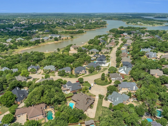 drone / aerial view featuring a residential view and a water view