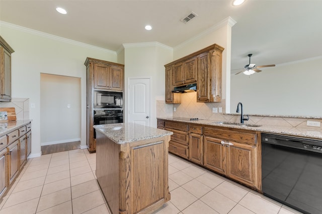 kitchen with a sink, black appliances, decorative backsplash, visible vents, and ventilation hood