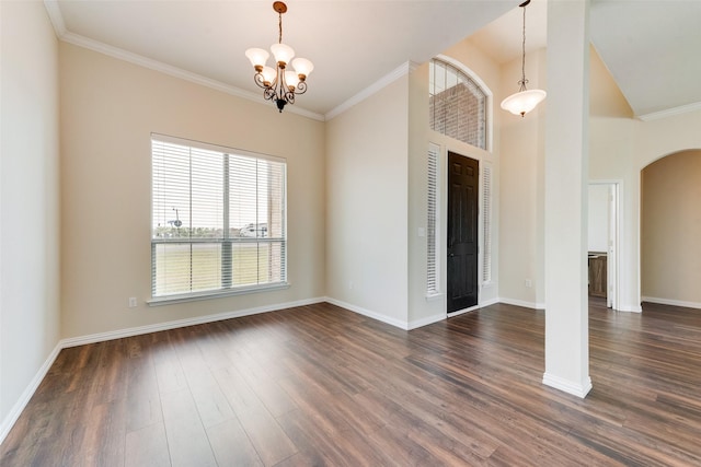 empty room with arched walkways, dark wood-type flooring, baseboards, and a notable chandelier