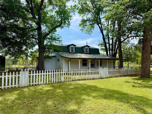 111 County Road 2156, Quitman, TX 75783 - farmhouse inspired home featuring a fenced front yard, a porch, and a front yard