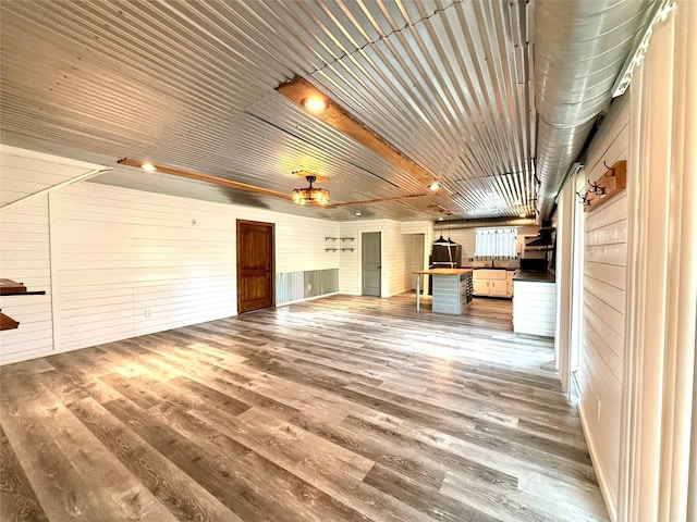 111 County Road 2156, Quitman, TX 75783 - unfurnished living room featuring wooden walls and wood finished floors