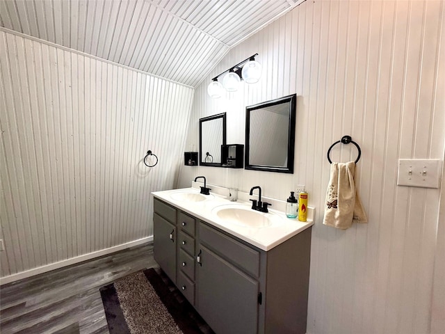 111 County Road 2156, Quitman, TX 75783 - full bathroom featuring double vanity, wood finished floors, lofted ceiling, and a sink
