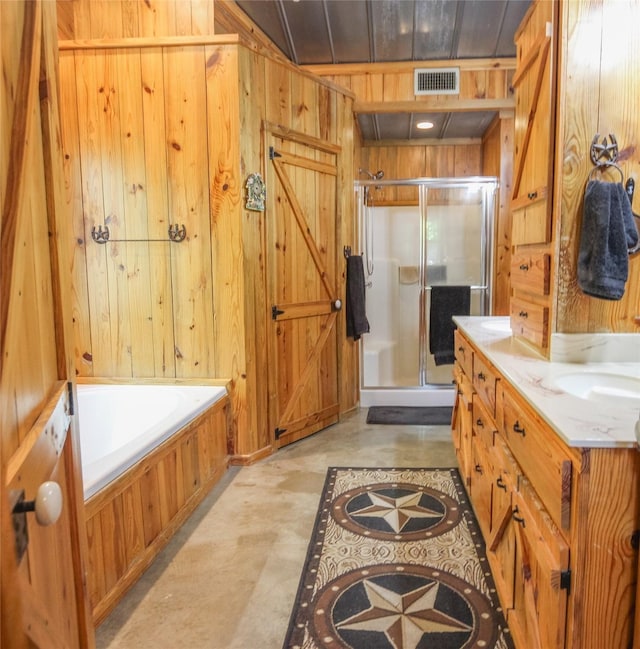 14615 County Road 2337, Tyler, TX 75707 - full bath featuring wooden walls, a shower stall, visible vents, and a garden tub
